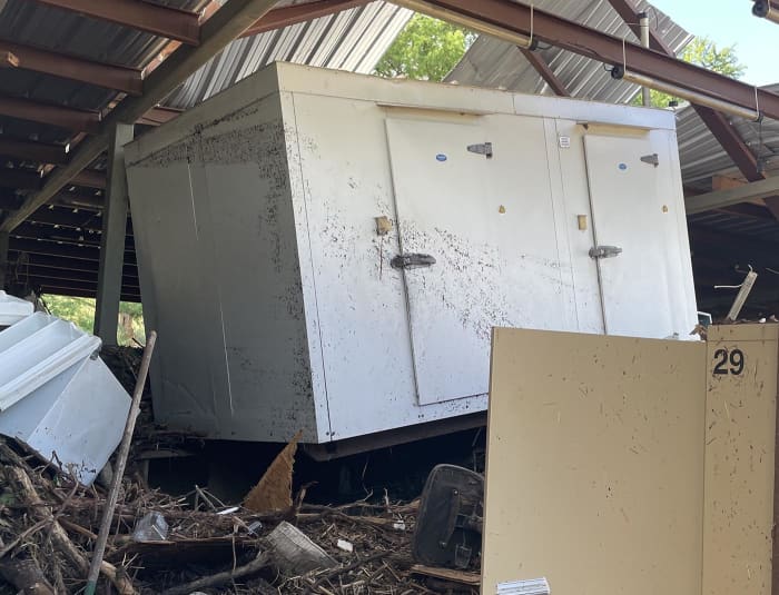 A cooler that pushed through Andi Fell’s home when it was lifted by water.