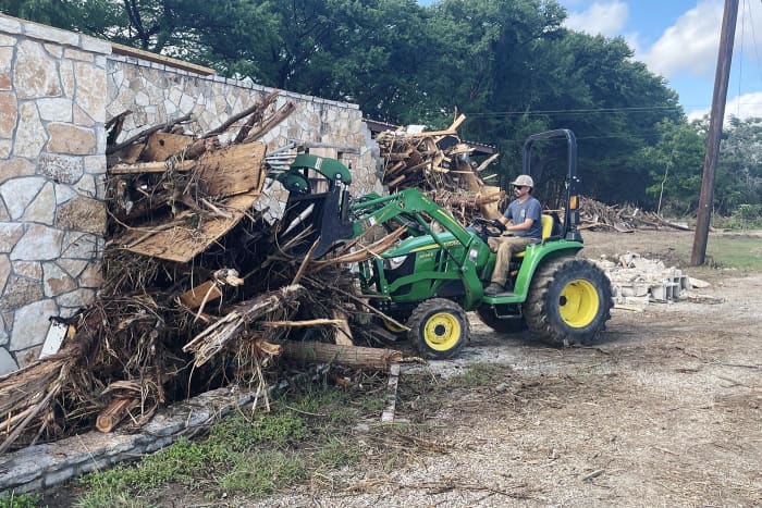 Debris removal at Andi Fell's home in Hunt, Texas.