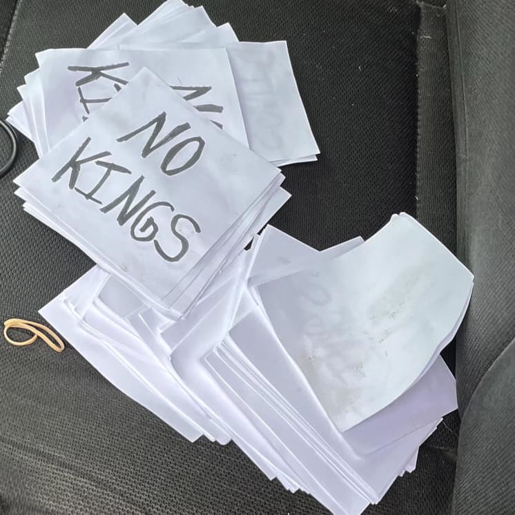"No Kings" posters found in the car of the suspect in the shootings of Minnesota lawmakers.