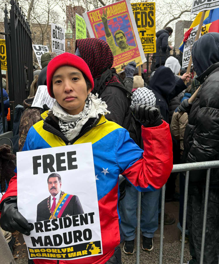 Rae Lee and other protesters call for Maduro's release.