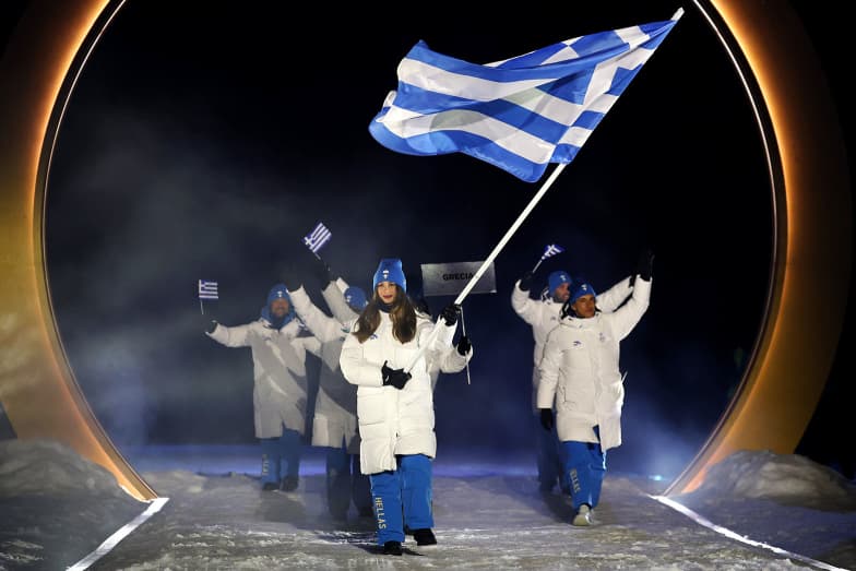 Flagbearer Nefeli Tita of Team Greece enters the stadium.