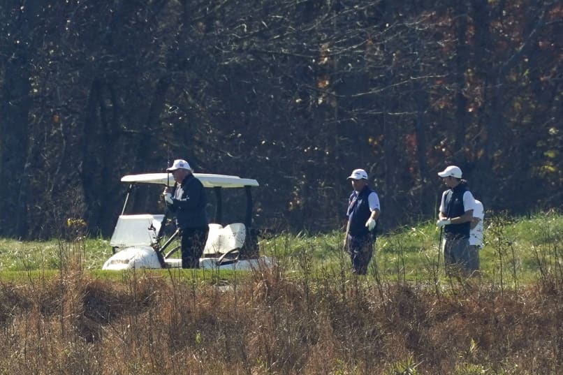 Image: President Donald Trump plays a round of golf at Trump National Golf Course in Sterling, Va., on Saturday.