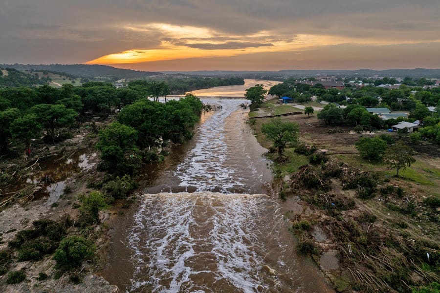 The sun sets over the Guadalupe River on July 6, 2025 in Kerrville, Texas. 
