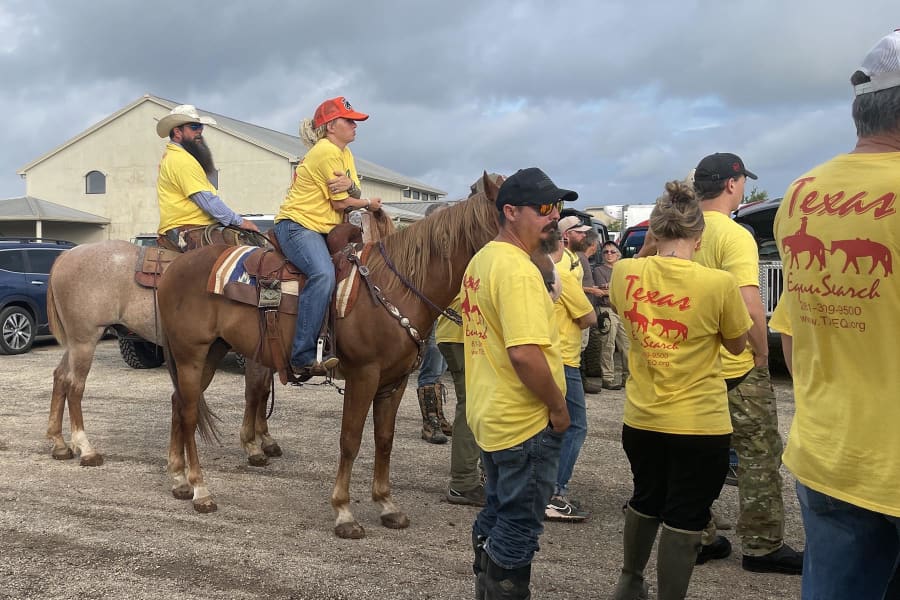 Members of Texas EquuSearch prepare to search along the Guadalupe River for victims of the July 4 flooding.