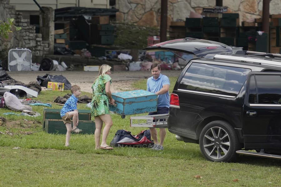 People come to pick up items at Camp Mystic