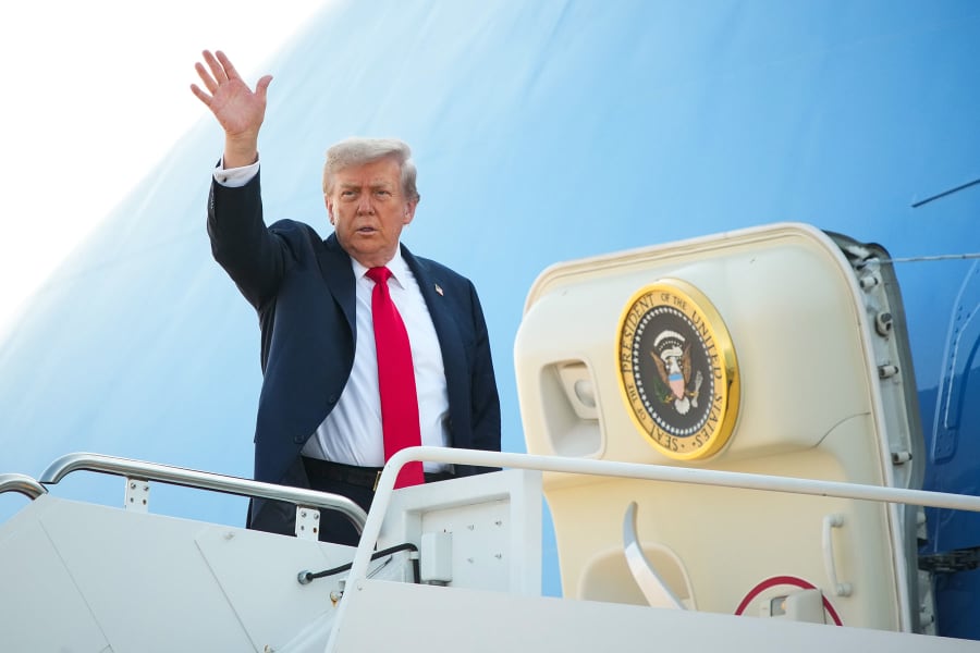 President Donald Trump boards Air Force One