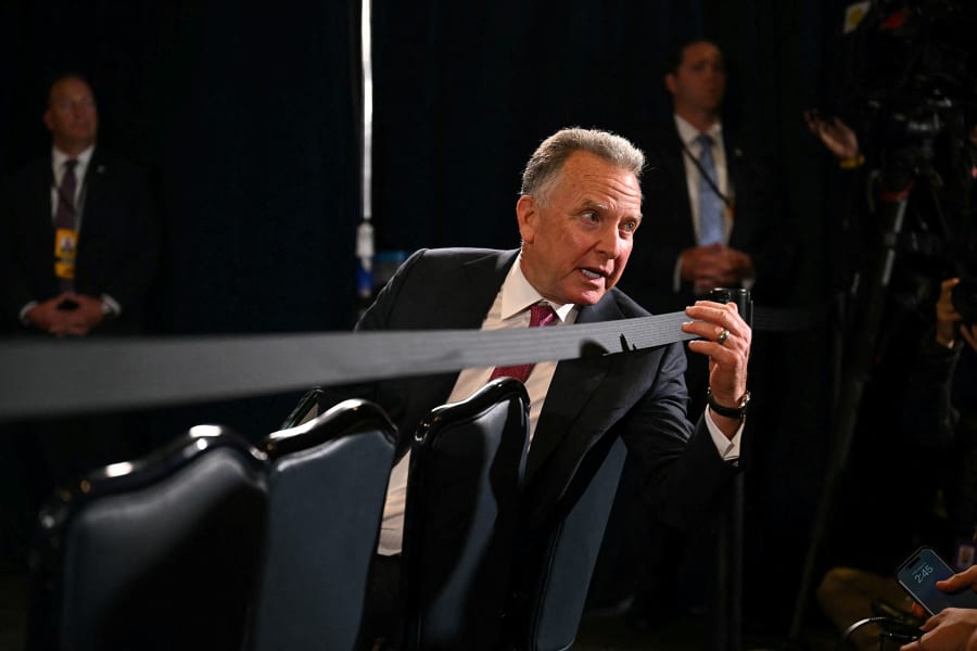 U.S. special envoy Steve Witkoff speaks with staff as he waits to attend President Donald Trump and Russian President Vladimir Putin's joint press conference in Anchorage, Alaska, on Aug. 15, 2025.