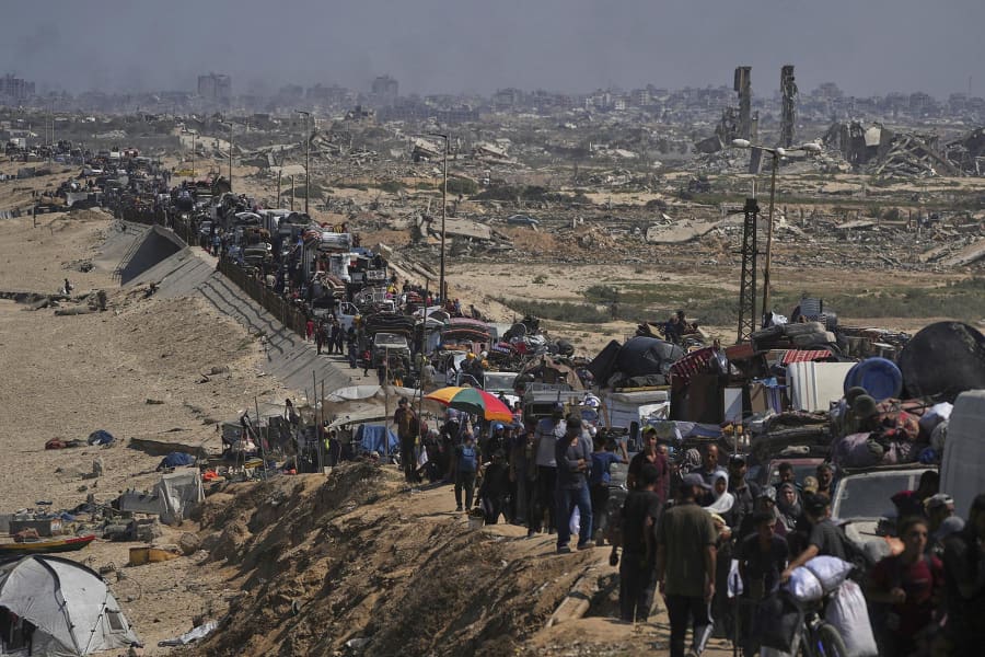 Displaced Palestinians flee northern Gaza along the coastal road toward the south on Tuesday, Sept. 16, 2025. 