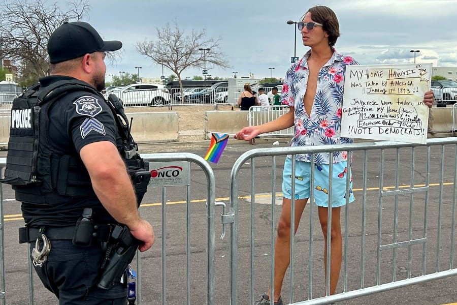 A protester in the designated protest zone at the Charlie Kirk memorial.