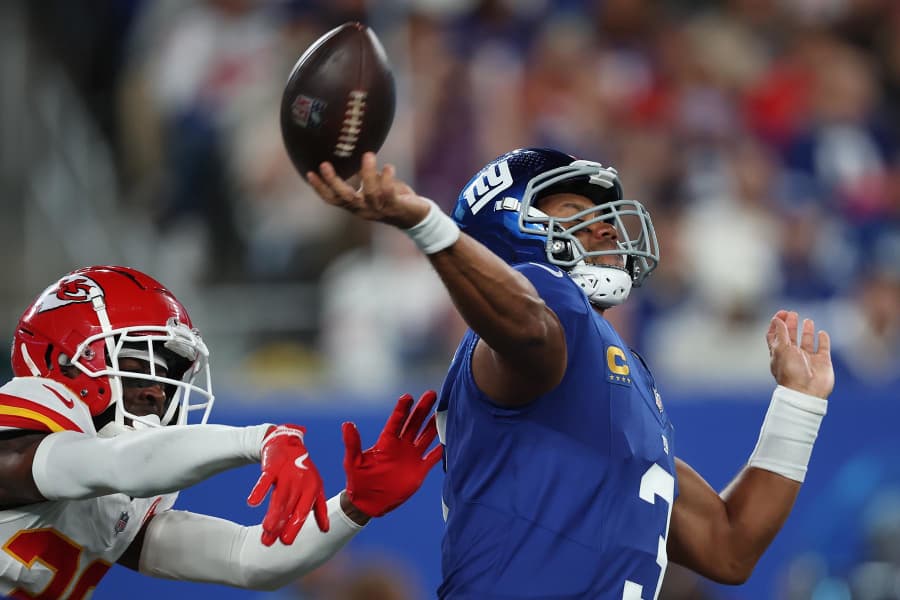 Russell Wilson of the New York Giants looks to pass 
