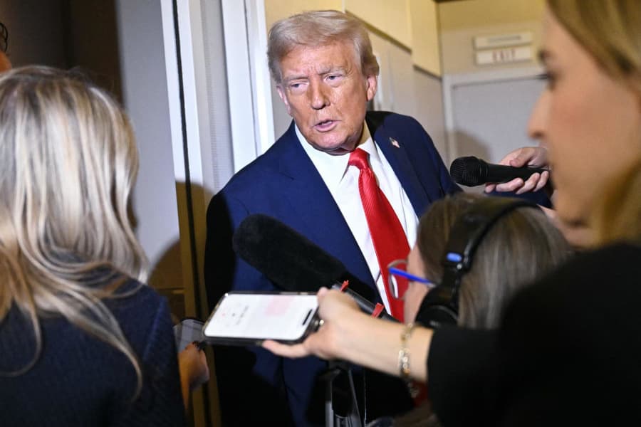 President Donald Trump speaks to reporters while in flight on Air Force One, en route Joint Base Andrews on September 21, 2025. 