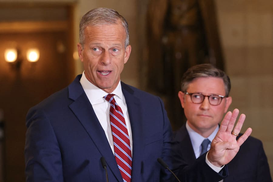 Senate Majority Leader John Thune speaks alongside House Speaker Mike Johnson at the Capitol on Oct. 3, 2025. 