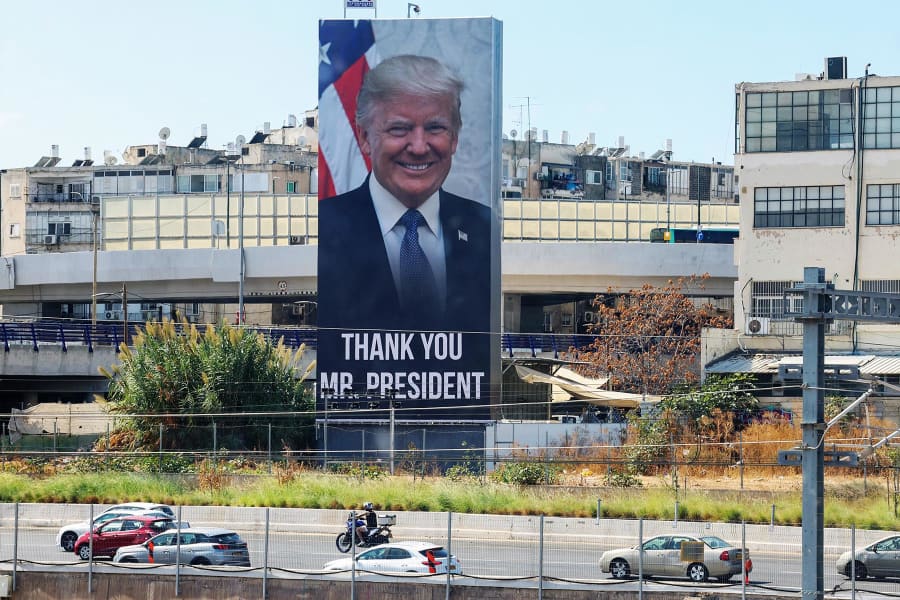 Motorists drive past a billboard thanking President Donald Trump in Tel Aviv on Oct. 10, 2025.