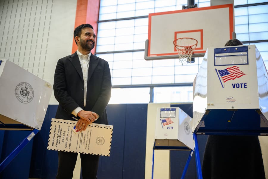 Democratic Mayoral Candidate Zohran Mamdani waits for his wife, Rama Duwaji, while voting at The Frank Sinatra School of the Arts on Nov. 4, 2025 in the Queens borough of New York.