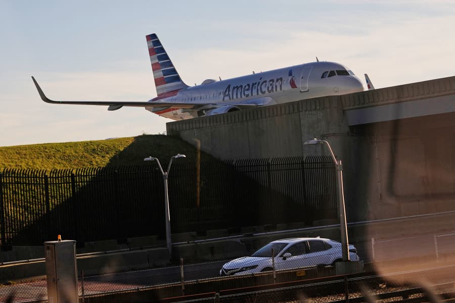 An American Airline plane moves between terminals at O'Hare International Airport in Chicago, Friday, Nov. 7, 2025. 