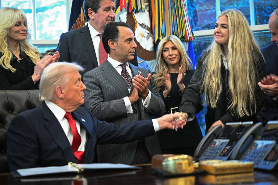 President Donald Trump greets Erika Kirk