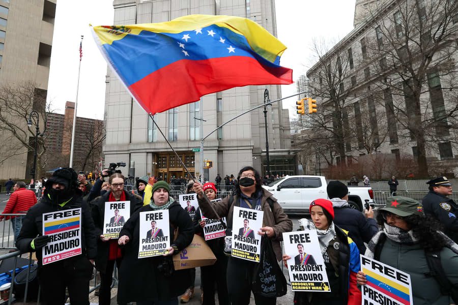 Demonstrators hold signs in support of ousted Venezuelan president Nicolas Maduro outside the Daniel Patrick Moynihan United States Courthouse as Maduro awaits his arraignment hearing on January 5, 2026.