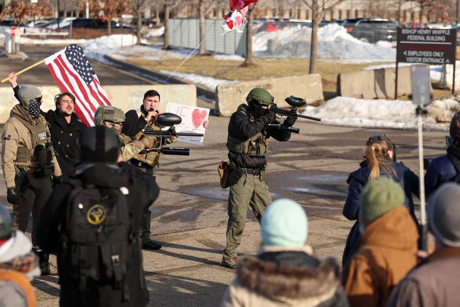 Federal agents try to contain the situation between protesters and counter-protesters near the Bishop Henry Whipple Federal Building in Minneapolis, Minnesota, on January 9, 2026. 