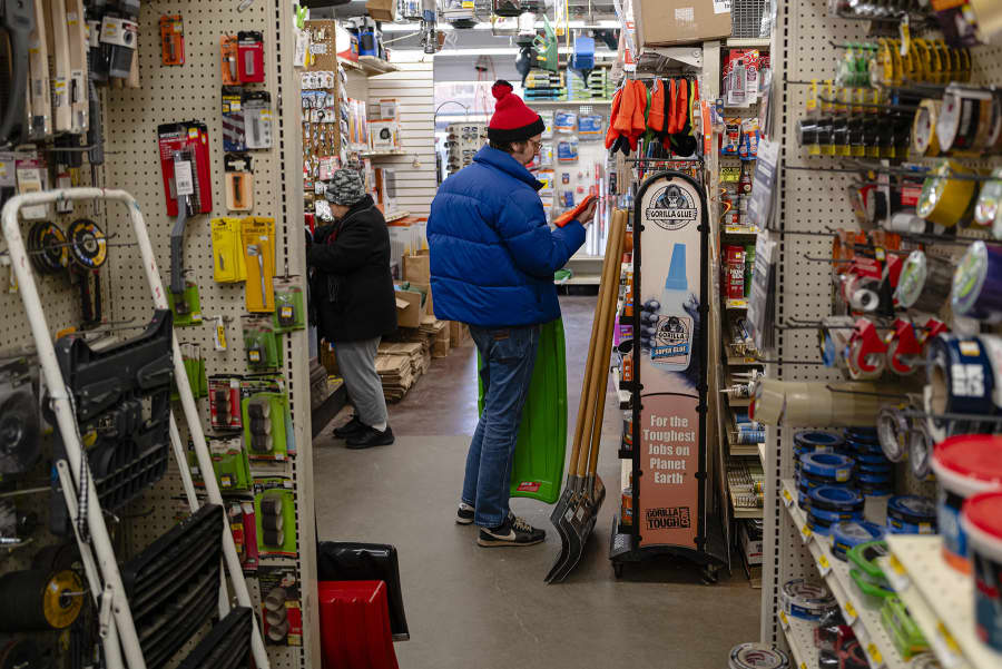 A customer looks at hats, sleds, and snow shovels at Keith's Hardware store on Jan. 23, 2026 in Louisville, Kentucky. 