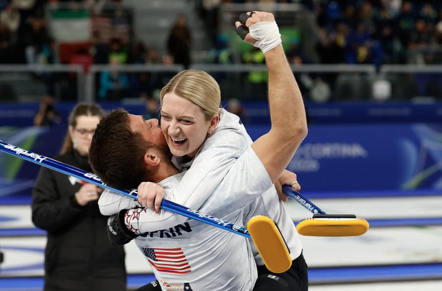 Cory Thiesse, right, and Korey Dropkin celebrate at the end of the curling mixed doubles round robin semi-final between USA and Italy during the Milano Cortina 2026 Winter Olympic Games at the Cortina Curling Olympic Stadium in Cortina d'Ampezzo on February 9, 2026. 