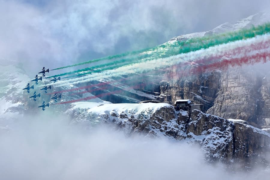 The Italian Aerobatic team, "Frecce Tricolori," fly over a deal ceremony at the 2026 Winter Olympics, in Cortina d'Ampezzo, Italy, Thursday, Feb. 12, 2026. 