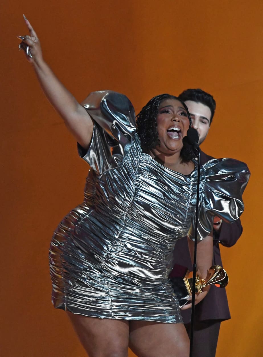 Lizzo accepts the award for record of the year.