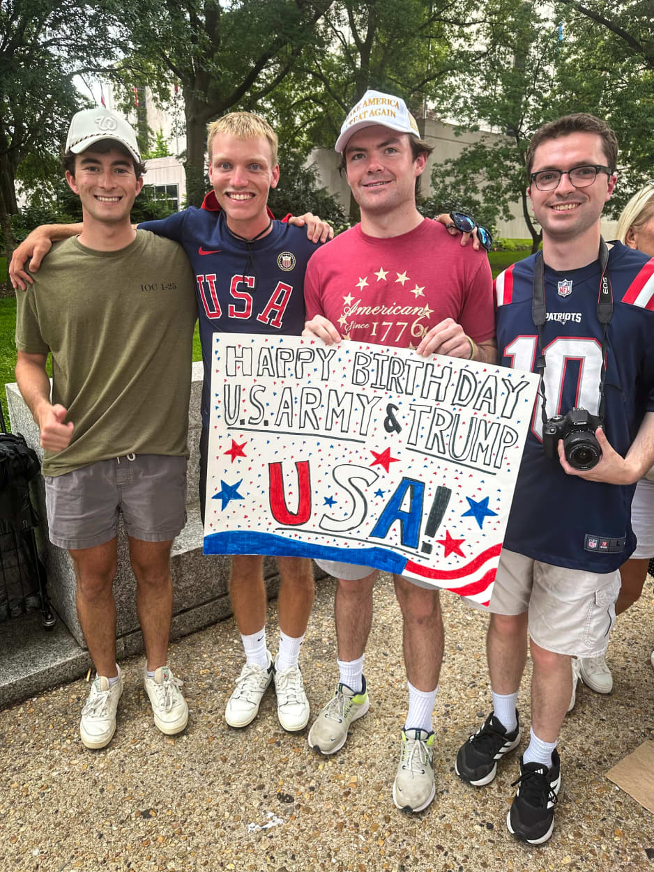 Sam Swartz, a 23-year-old from Jacksonville, Fla., with his friends at the military parade.