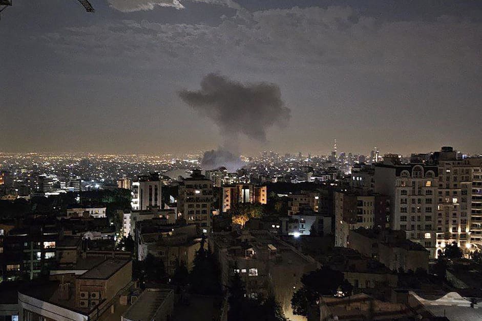 Smoke billows from a site reportedly targeted by an Israeli strike in the Iranian capital Tehran early in the morning of June 13, 2025.