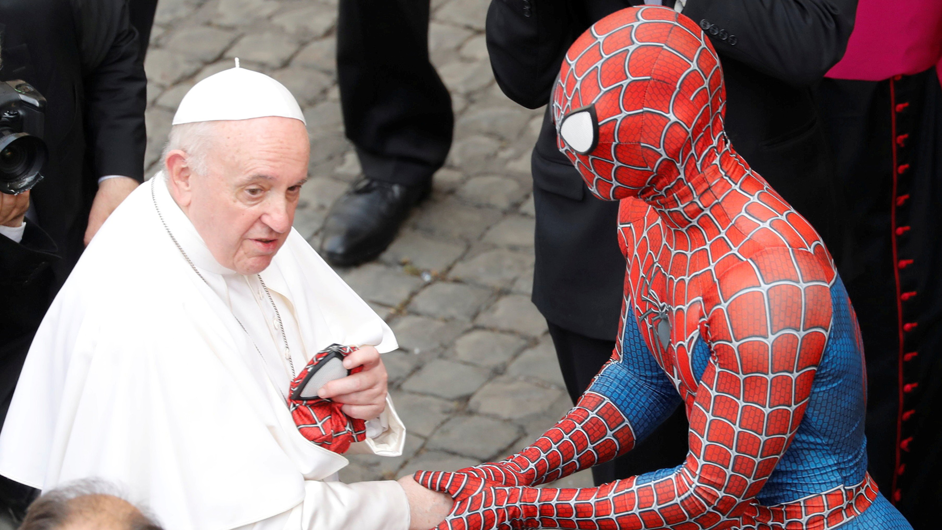 Spider-Man gifts Pope Francis a mask in viral meeting