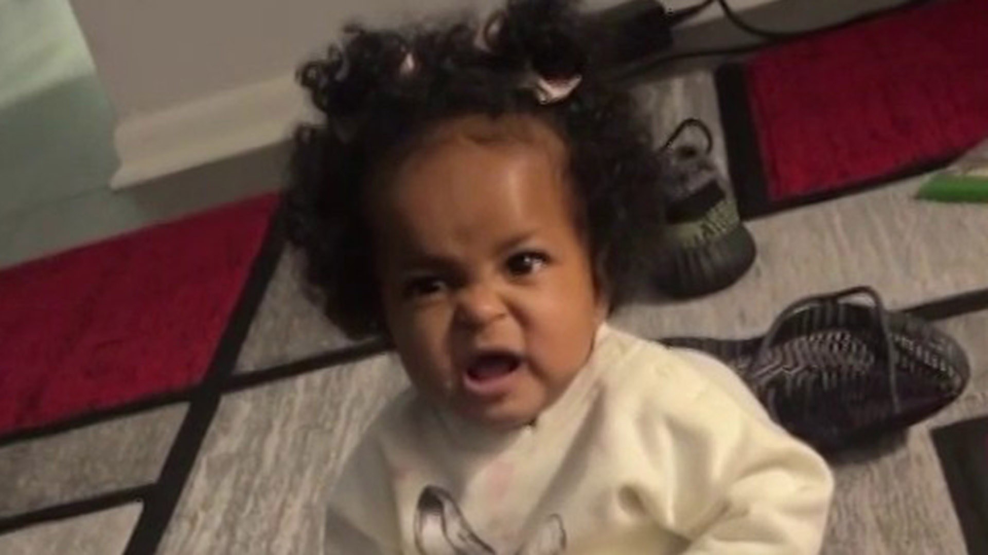 A baby cries after opening a book (funny) on Make a GIF