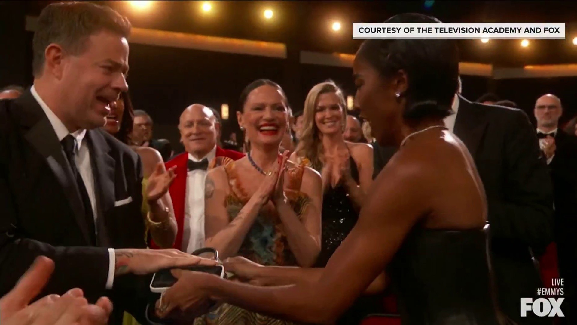 Watch Ayo Edebiri hand Carson Daly her purse during Emmy win
