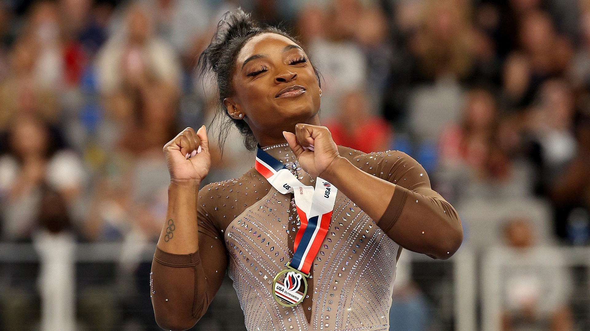 Simone Biles wins gymnastics title, clinching spot for Olympics trial