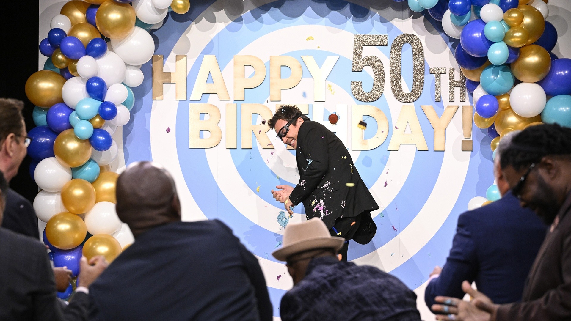 The Roots pelt Jimmy Fallon with cupcakes for 50th birthday