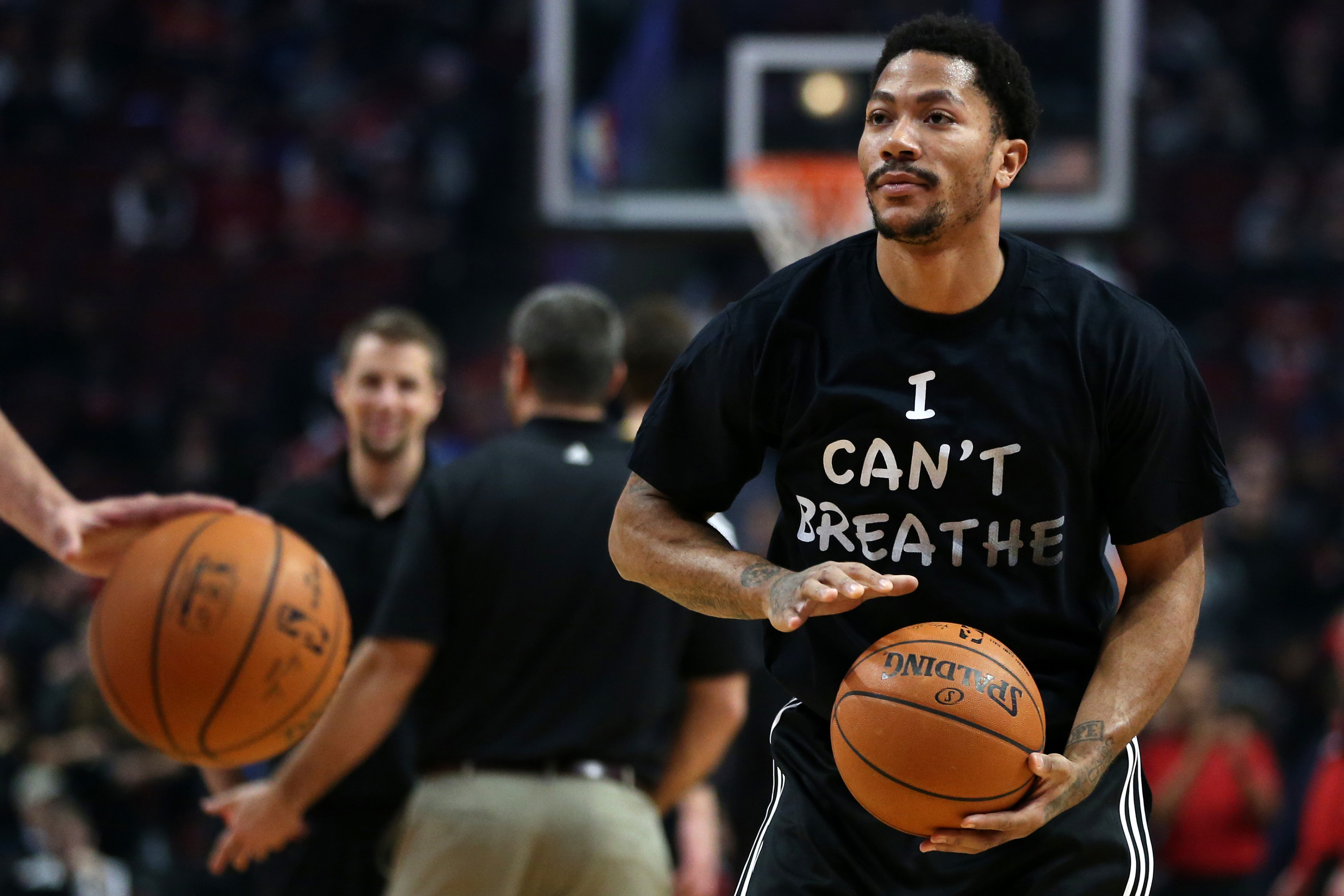 Chicago Bulls guard Derrick Rose stands on the court during the