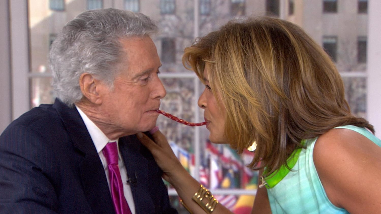 Regis Philbin kisses Hoda Kotb for Twizzler Challenge on TODAY