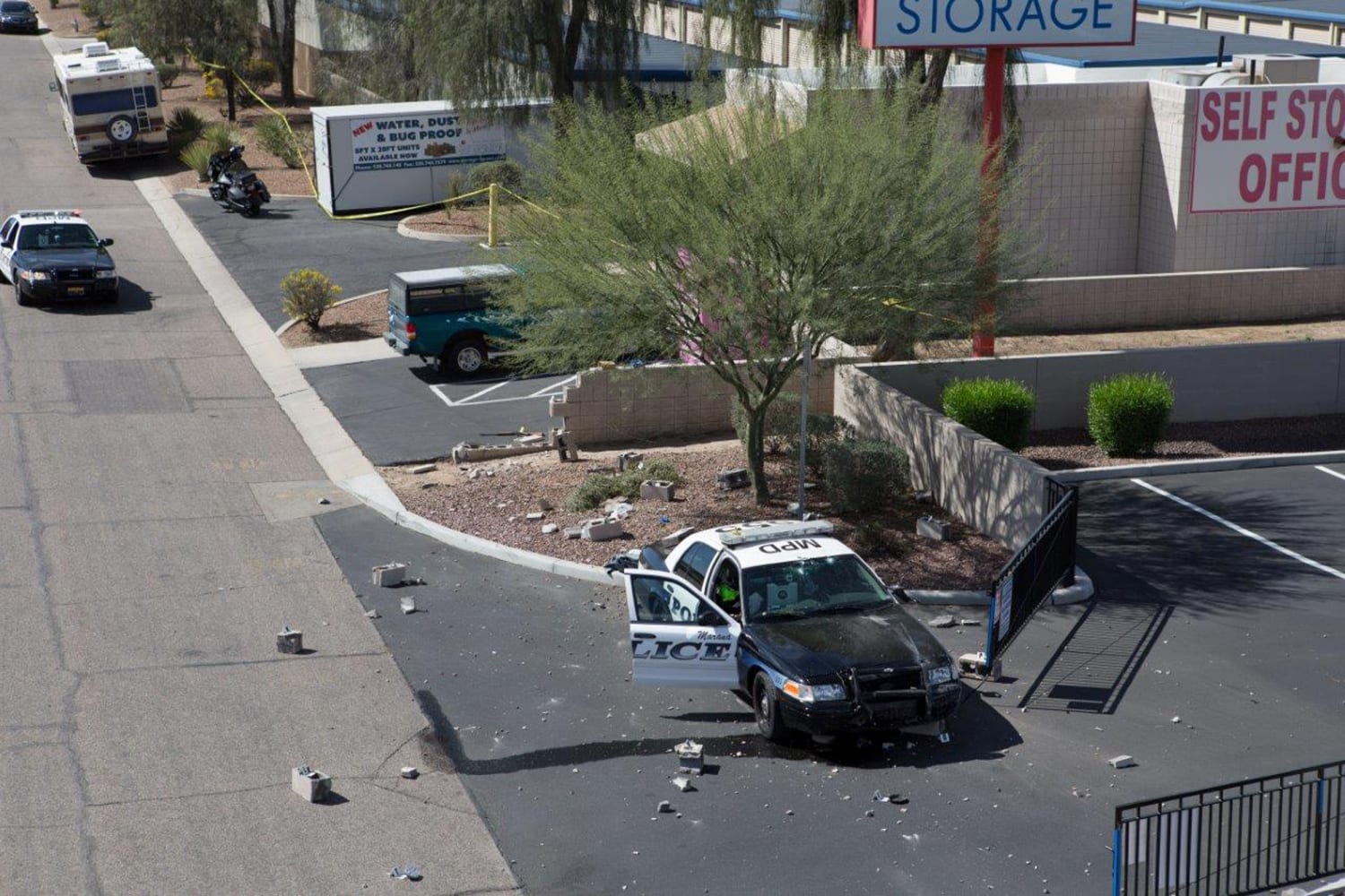 Photos Show Damage After Cop Car Rammed Gunman