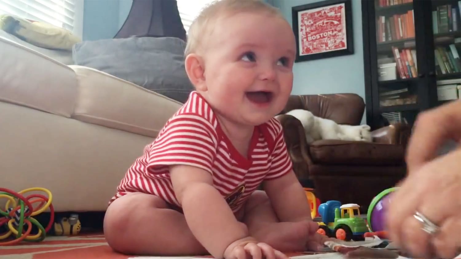 Viral video shows baby laughing when parents tear catalog