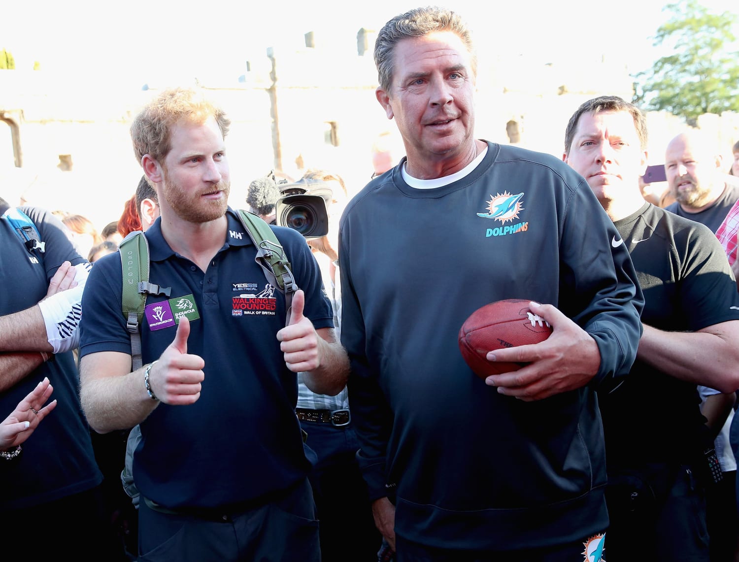 Prince Harry tosses the football with Dan Marino