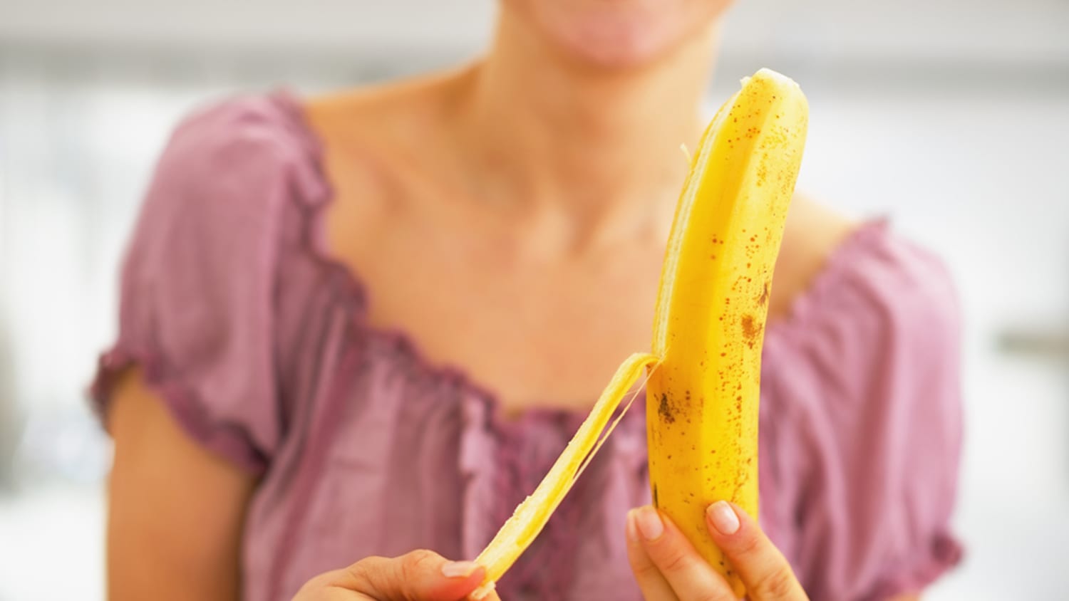 woman eating banana