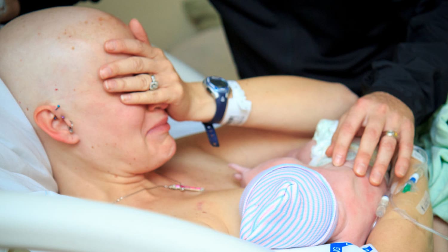 Mom with breast cancer breastfeeds newborn in beautiful photo