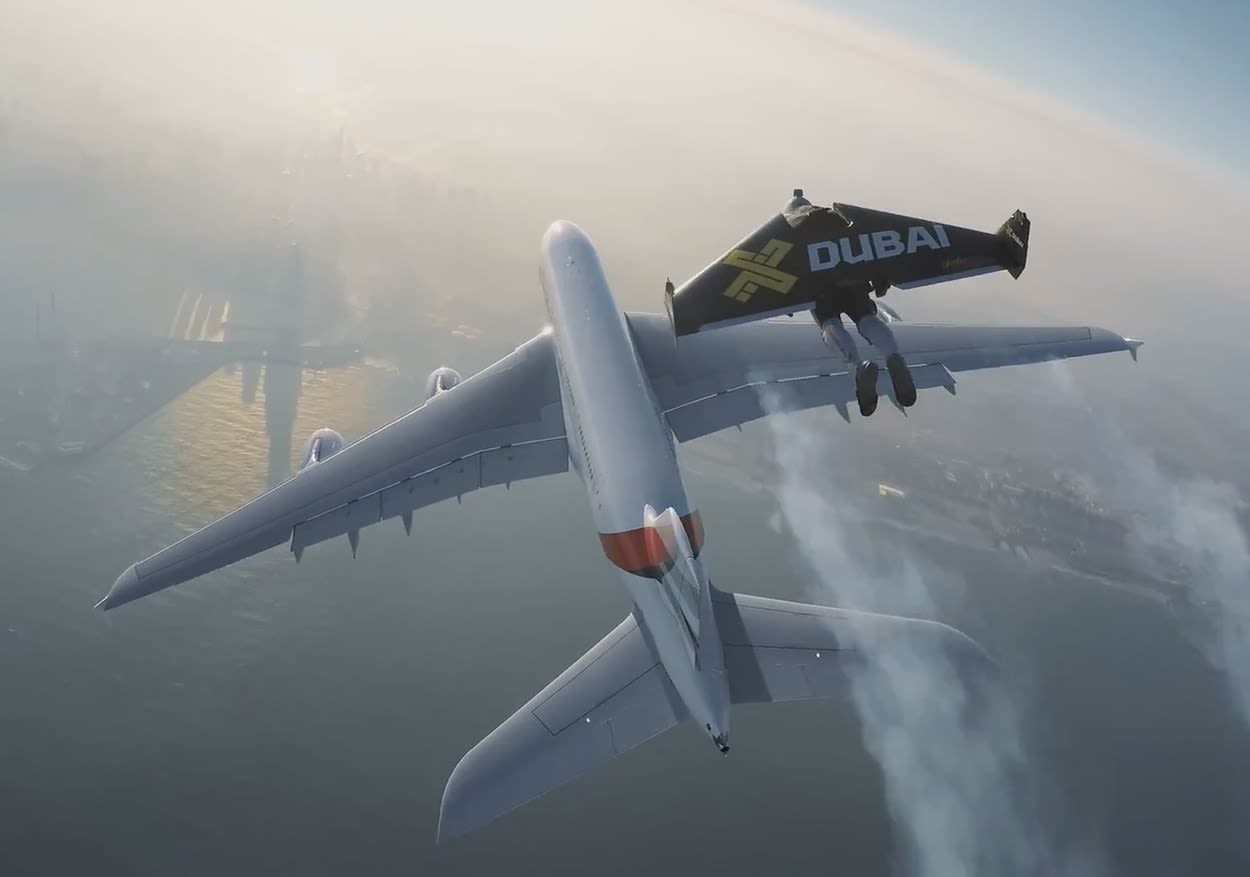 Watch Two Men in Jetpacks Fly Alongside a Jumbo Jet Over Dubai