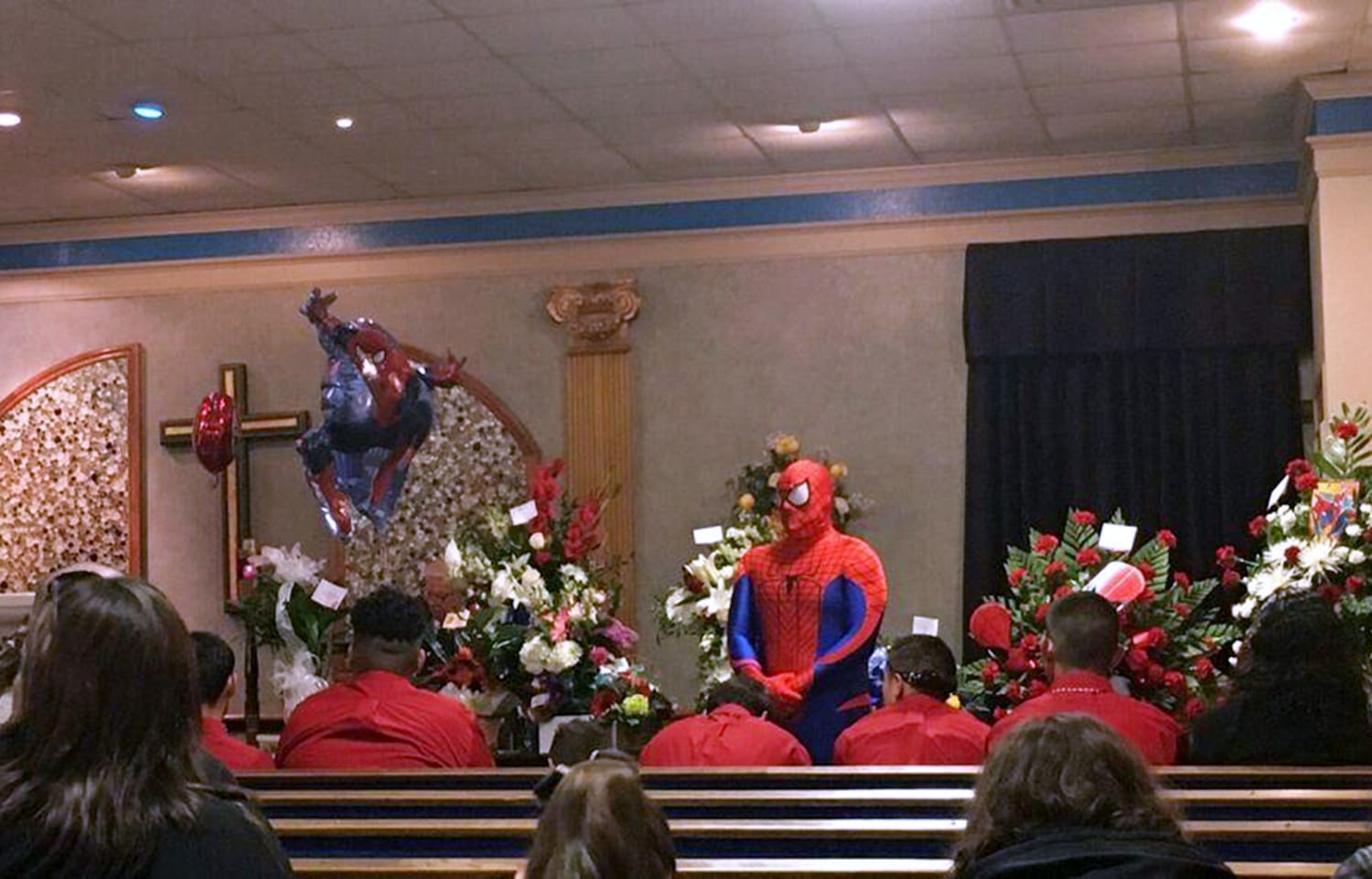 Cop dresses as Spider-Man at boy's funeral: 'I wish I had super powers to  save him'