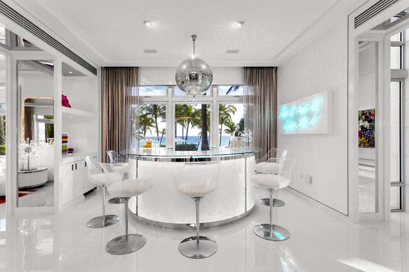 Fashion Designer Tommy Hilfiger's Vibrant Home in Miami  Modern home bar  designs, Modern home bar, Home bar designs
