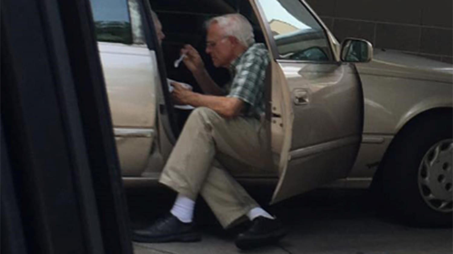 elderly man feeding ice cream
