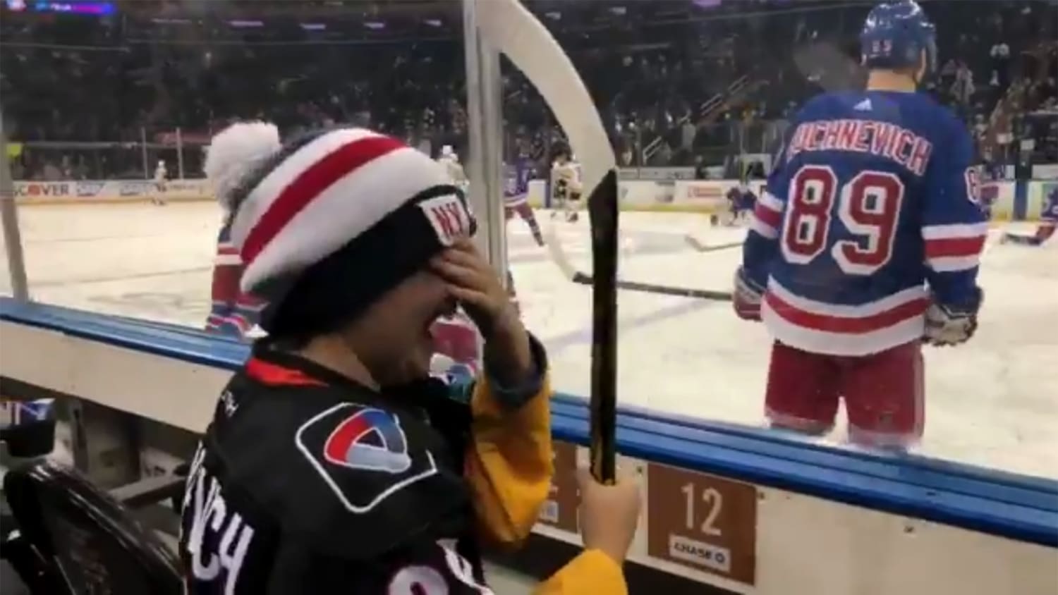 New York Ranger Pavel Buchnevich tosses young fan a stick, makes him weep with joy