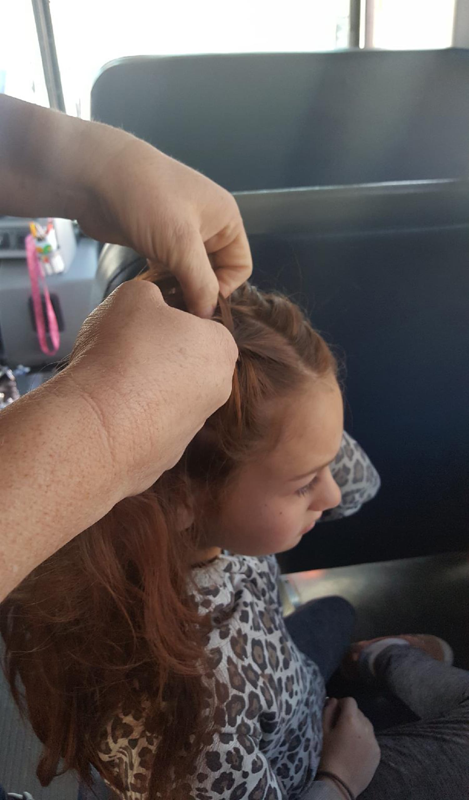 Bus driver steps in to braid girl's hair after her mother dies