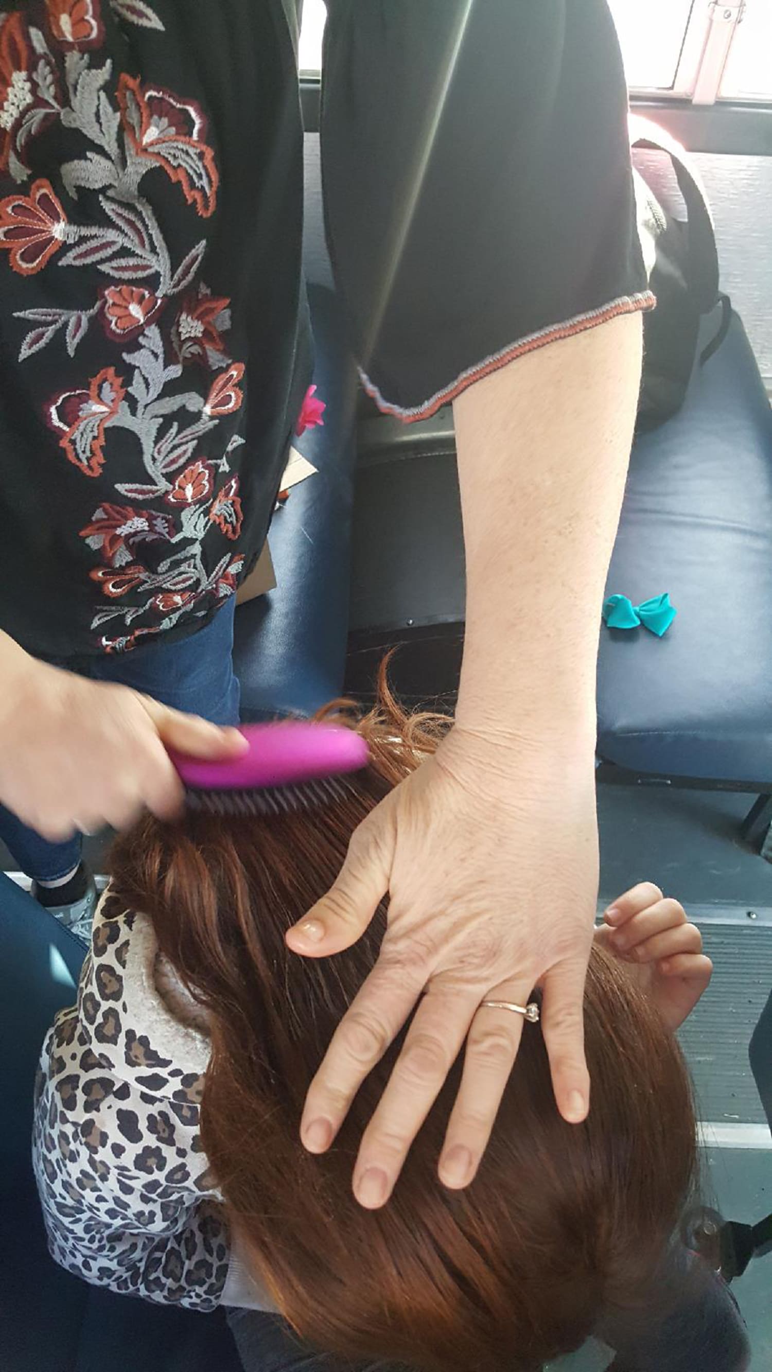 Bus driver steps in to braid girl's hair after her mother dies