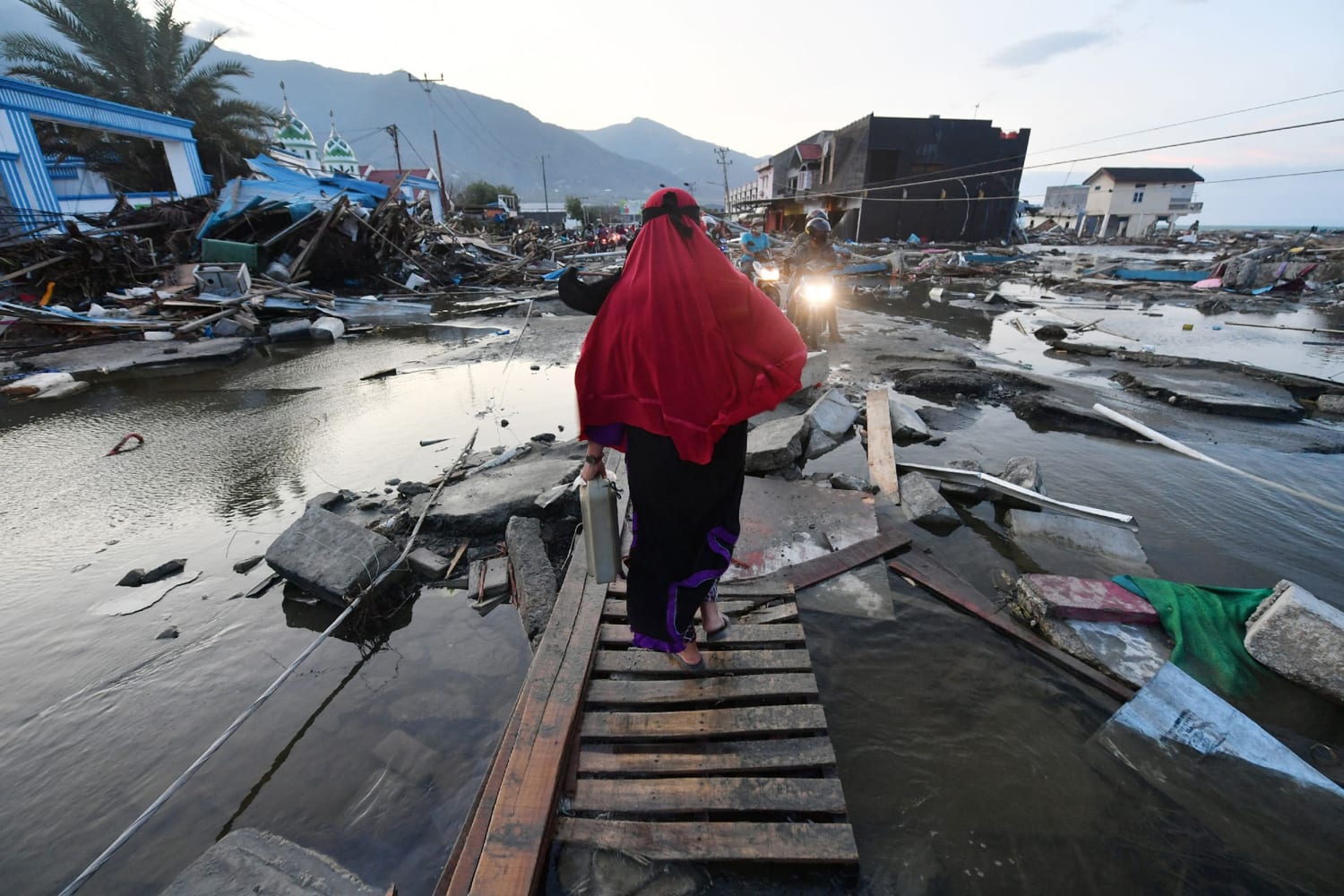 Rescues And Mass Graves: Scenes Of Devastation In Hard-Hit Indonesian City