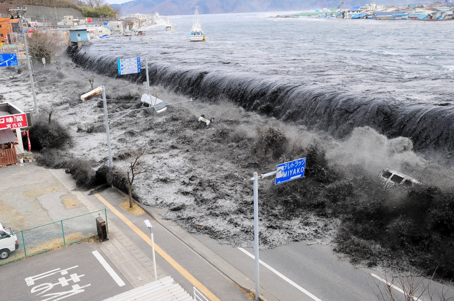 Tsunami wave sweeping through a town