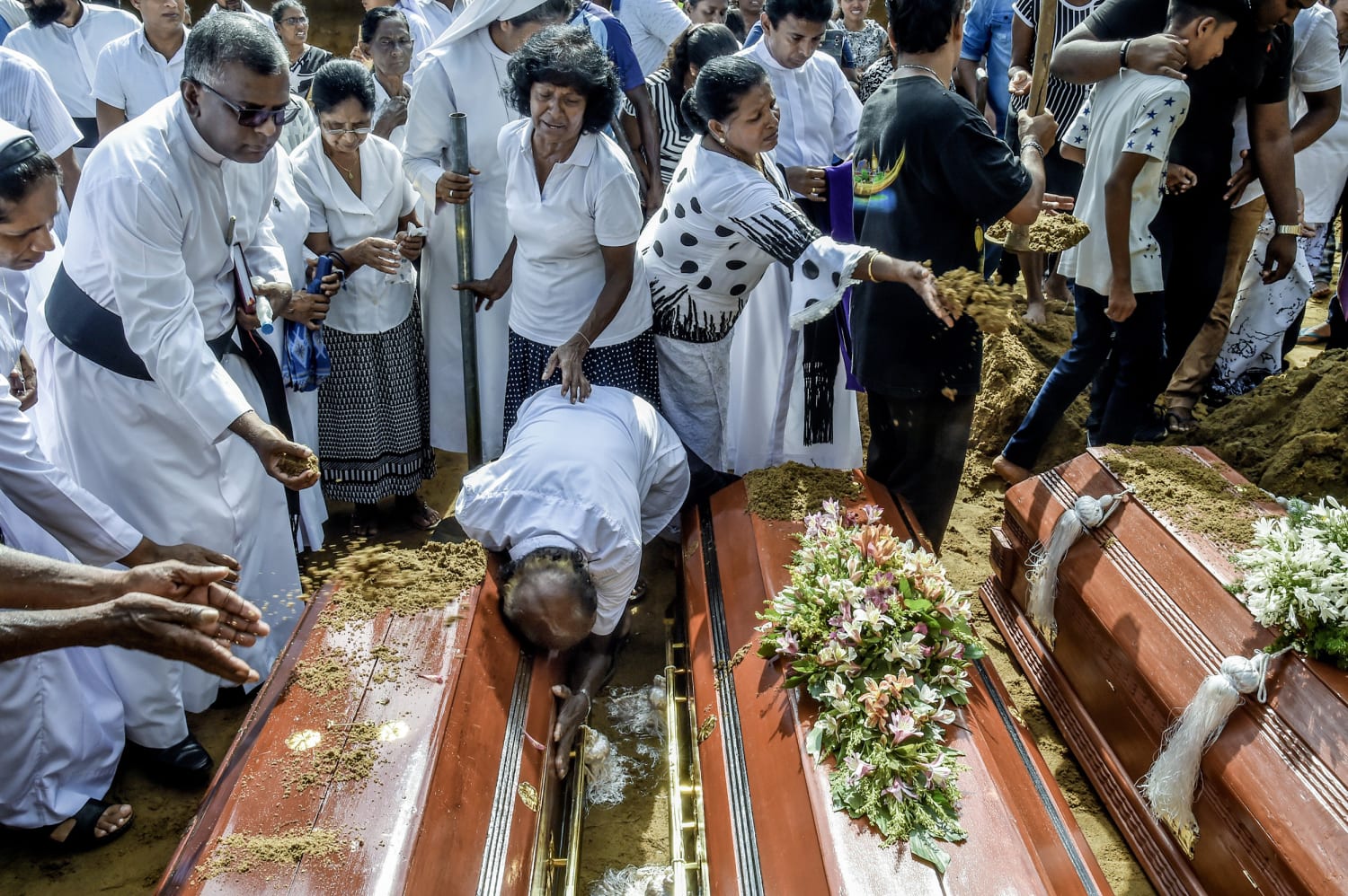 Sri Lankans mourn bombing victims during funerals